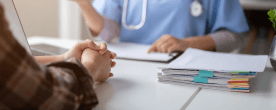 A patient meets with a medical professional